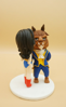 Picture of Wonder Woman and The Beast wedding cake topper