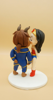 Picture of Wonder Woman and The Beast wedding cake topper