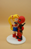 Picture of Sailor Moon and DeadPool wedding cake topper