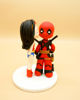 Picture of Wonder Woman and Dead Pool Wedding Cake Topper