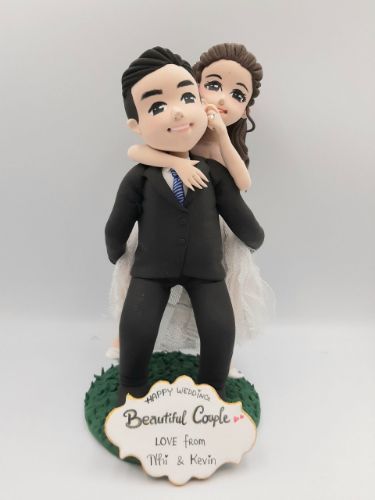 Picture of Personalised Piggy Back Wedding Cake Topper