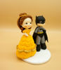 Picture of Belle and Batman Wedding Cake Topper