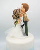 Picture of Police and Nurse with a dog wedding cake topper, Kissing forehead wedding cake topper