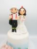 Picture of Firefighter and nurse wedding cake topper