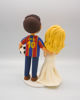 Picture of Soccer wedding cake topper, Qatar football fan wedding clay figurine