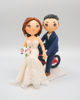 Picture of Bicycle bride and groom wedding cake topper