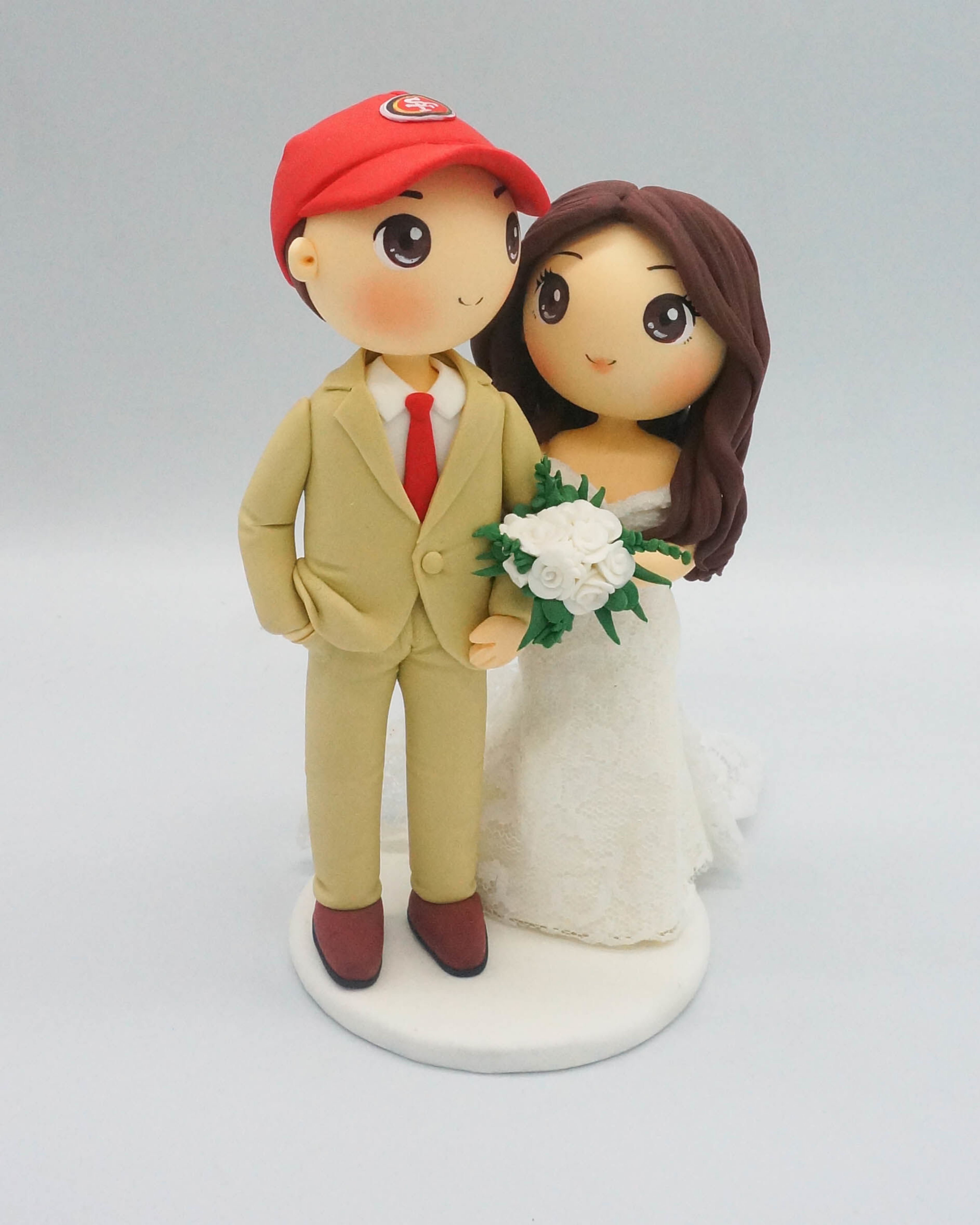 Picture of Football fan wedding cake topper, custom groom cake topper