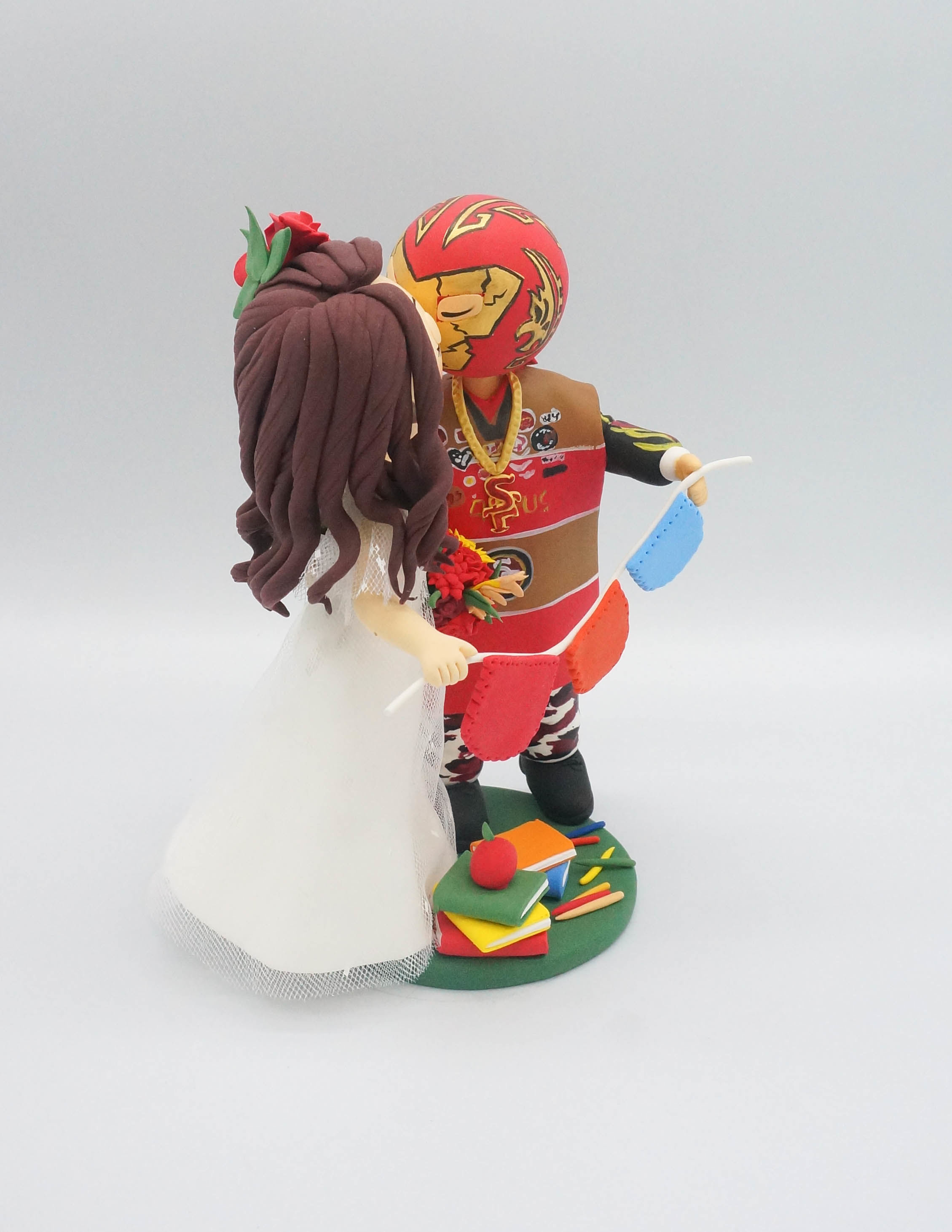 World Cake Topper. San Francisco 49ers fan groom & school teacher bride  wedding cake topper