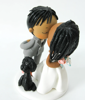 Picture of Ghana wedding cake topper, bride and groom wedding cake topper with dog