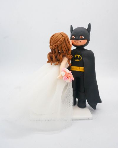 Picture of Batman Groom Bride Wedding Cake Topper, Cheek Kissing Wedding Cake Topper