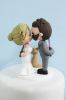 Picture of Harry Potter & Star Wars wedding cake topper, bride & groom with dog cake topper