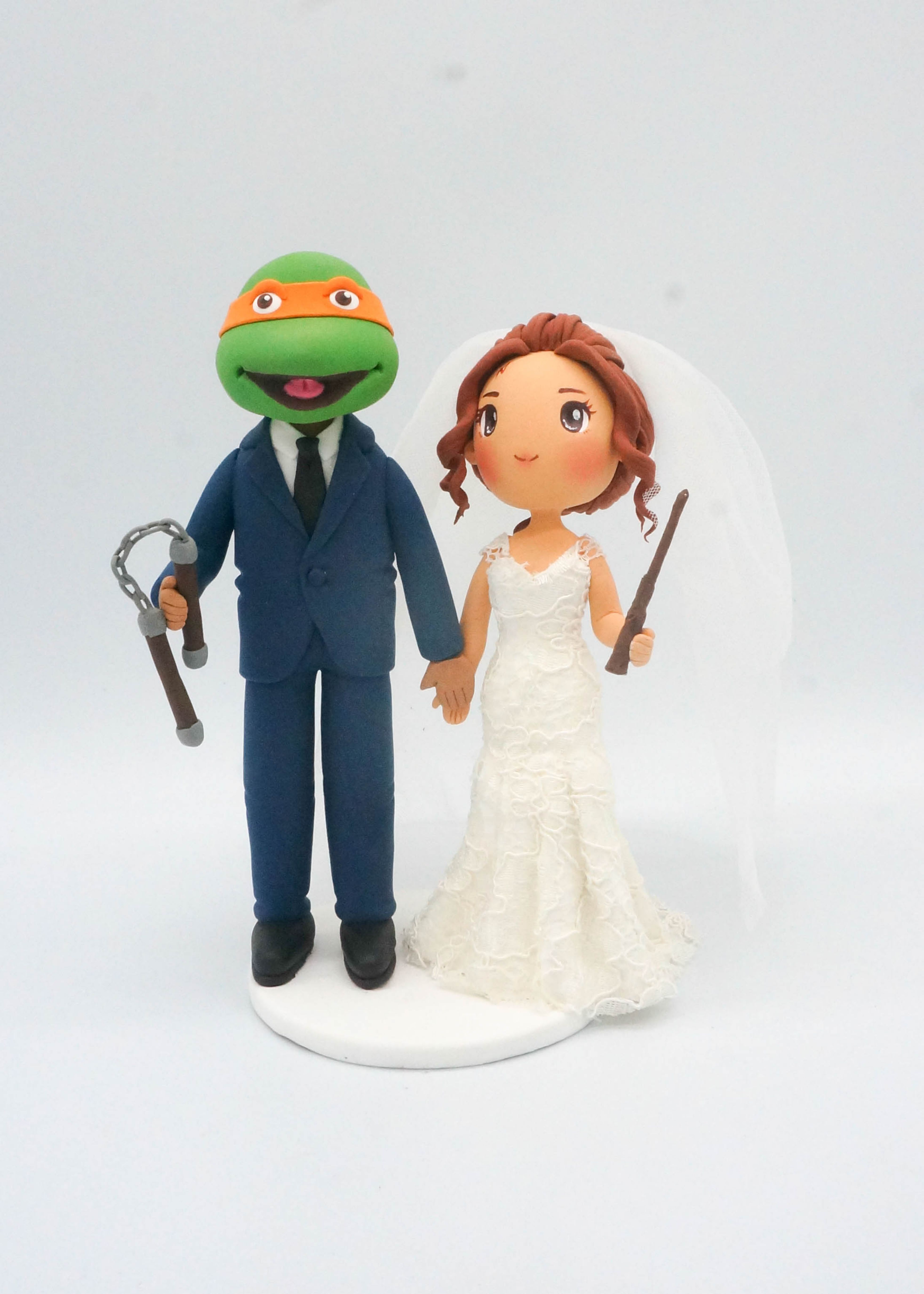 Picture of Ninja Turtle and Hogwarts Bride Wedding Cake Topper