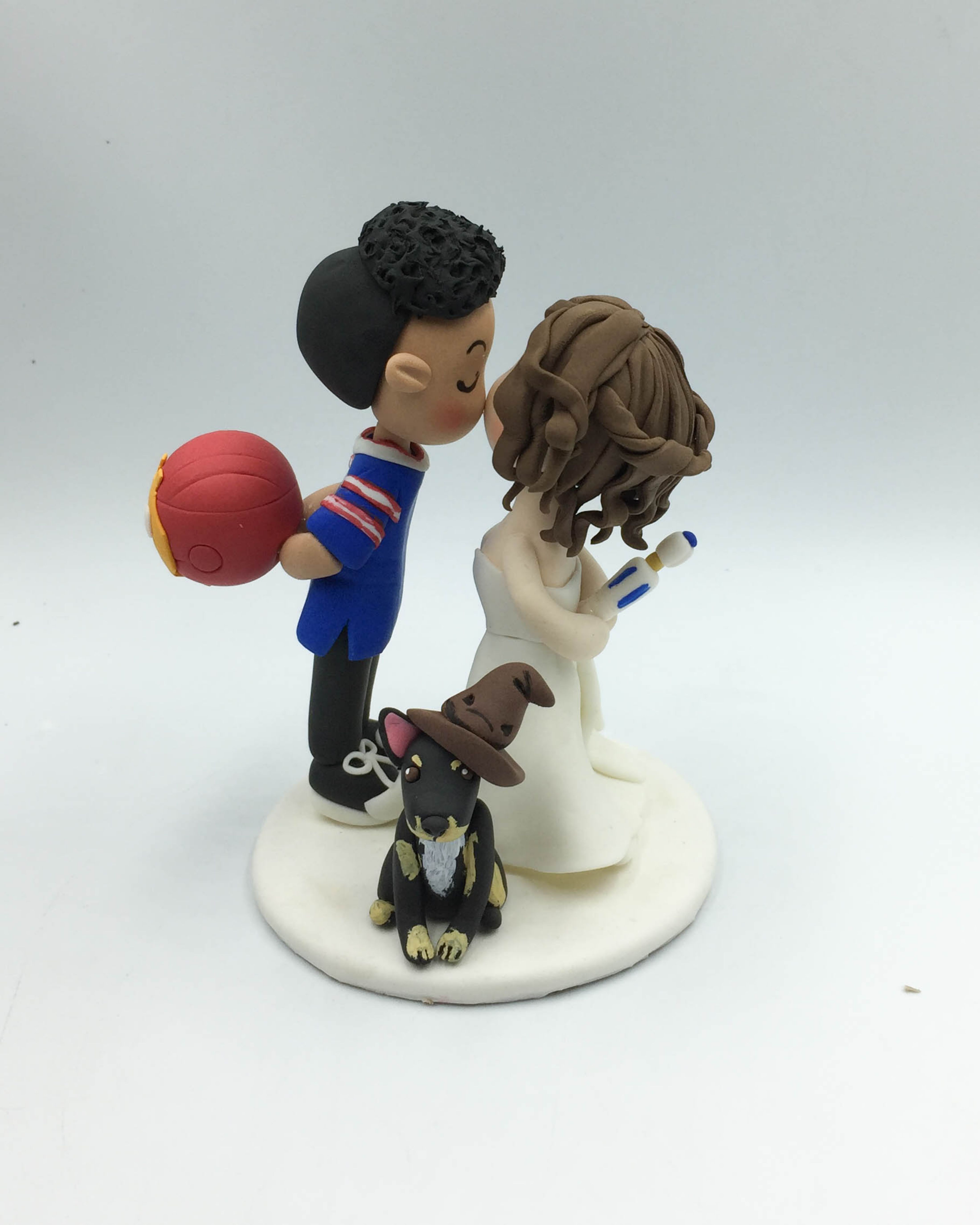Picture of Football groom Iron Man and Doctor Who Bride Wizard dog inspire wedding cake topper