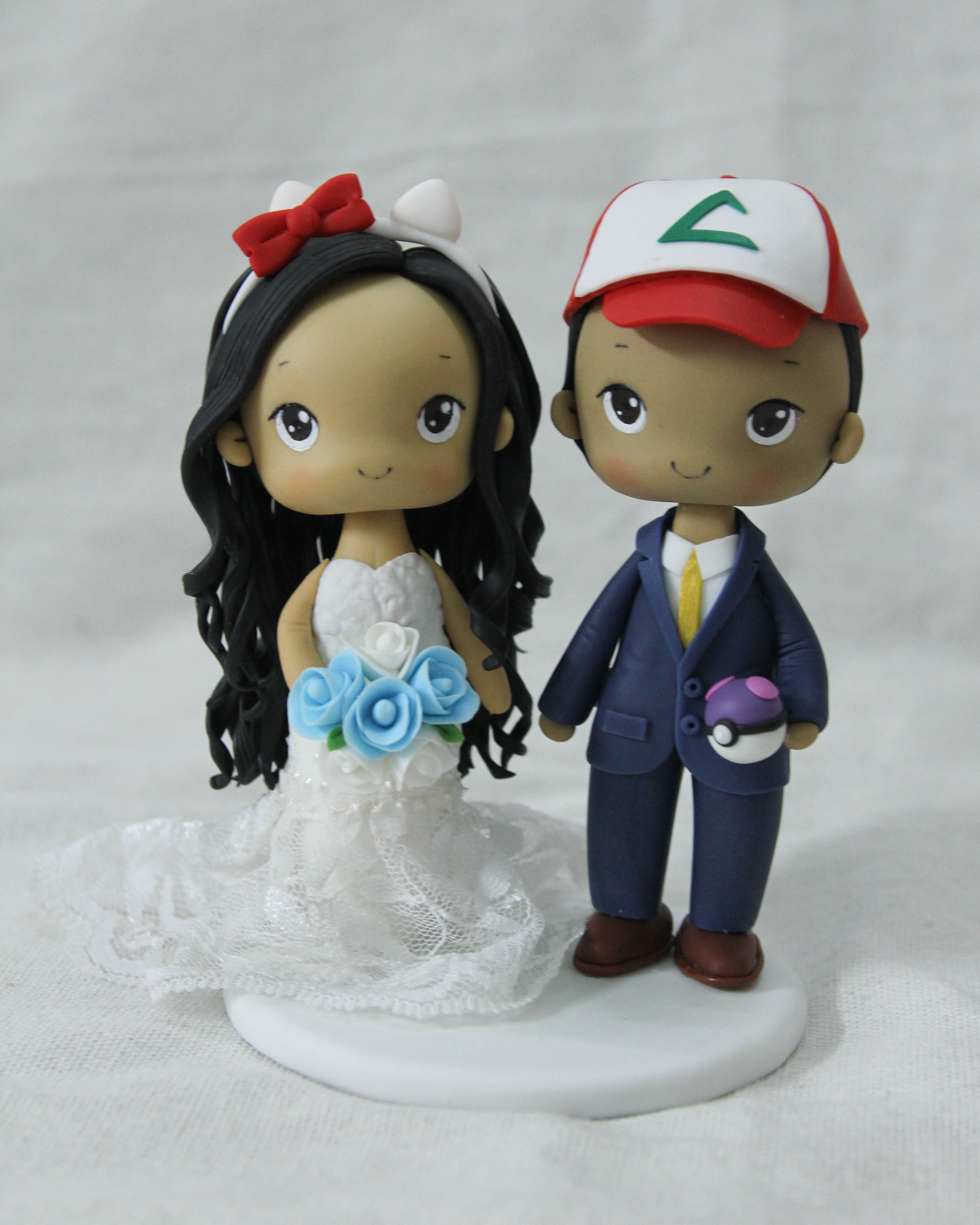 Picture of Pokemon and Hello Kitty wedding cake topper, Anime lover and Gamer wedding theme