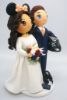 Picture of Motorcycle Racer Groom & Minnie Mouse Bride Wedding Cake Topper, Traveler and Gamer wedding cake topper